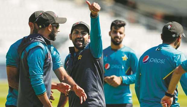 Pakistan captain Sarfaraz Ahmed (centre) gestures during a practice session at Lordu2019s Cricket Ground in London yesterday. (AFP)