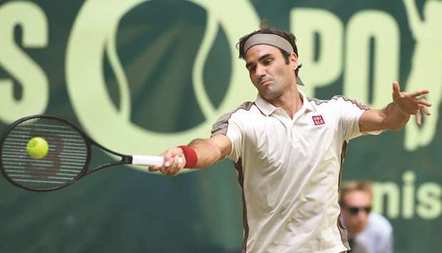 Roger Federer from Switzerland returns the ball to Franceu2019s Pierre-Hugues Herbert in Halle yesterday.