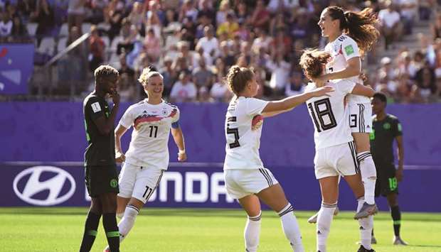 Germanyu2019s midfielder Sara Dabritz (right) celebrates after scoring a goal against Nigeria in the last 16 match at the Womenu2019s World Cup in Grenoble, central France. (AFP)