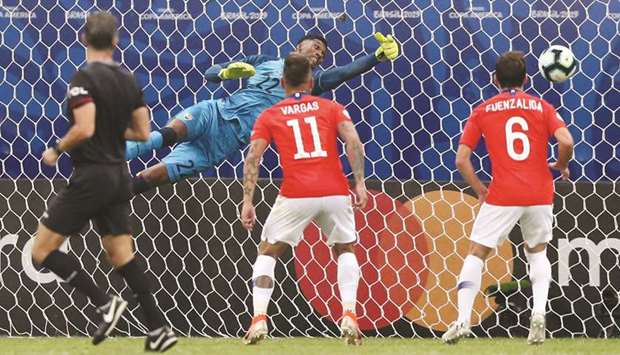 Ecuadoru2019s goalkeeper Alexander Dominguez fails to save a shot from Chileu2019s Alexis Sanchez (not in picture) during the Copa America Group C match at the Arena Fonte Nova in Salvador, Brazil on Friday night. (Reuters)
