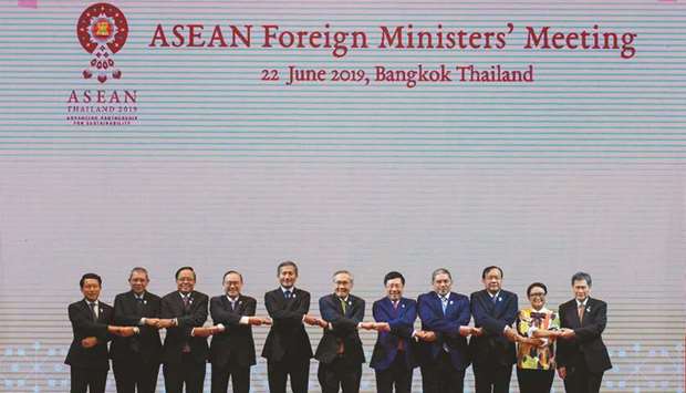 From left: Laos Foreign Minister Saleumxay Kommasith, Malaysia Foreign Minister Saifuddin Abdullah, Myanmaru2019s Union Minister for International Co-operation Kyaw Tin, Philippinesu2019 Foreign Minister Teodoro Locsin, Singapore Foreign Minister Vivian Balakrishnan, Thailand Foreign Minister Don Pramudwinai, Vietnam Foreign Minister Pham Binh Minh, Brunei Second Minister of Foreign Affairs and Trade Erywan Yusof, Cambodia Foreign Minister Prak Sokhonn, Indonesia Foreign Minister Retno Marsudi and Asean Secretary-General Lim Jock Hoi pose for a group photo during the Asean Foreign Ministersu2019 meeting ahead of the Asean summit in Bangkok yesterday.