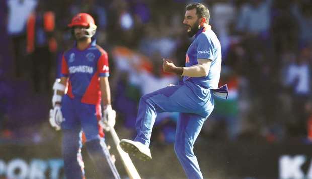 Indiau2019s Mohamed Shami celebrates taking the wicket of Afghanistanu2019s Aftab Alam (not pictured) during the 2019 ICC Cricket World Cup match at The Ageas Bowl in Southampton, United Kingdom, yesterday. (Reuters)