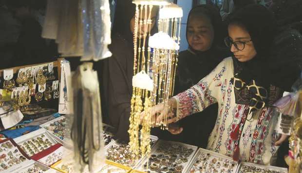 Women browse jewellery at a shop in Karachi ahead of the Eid earlier this month. Officials have said that the FBR is all geared up to launch a drive against jewellers and moneychangers in possession of undeclared gold and foreign currencies, respectively.