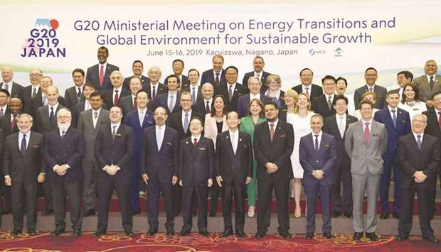 Ministers and delegates, including Japanu2019s Minister of Economy, Trade and Industry Hiroshige Seko and Environment Minister Yoshiaki Harada, gather for a family photo session at G20 energy and environment ministers meeting in Karuizawa, Japan, on June 15, in this photo taken by Kyodo.