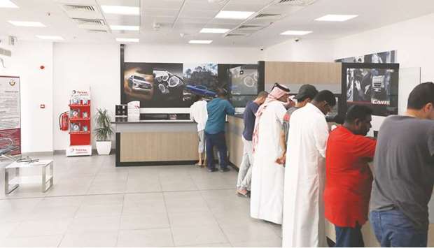 Staff attend to customers at the service centre.