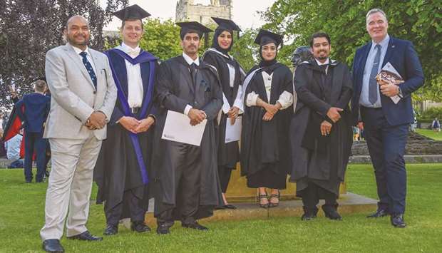 Some of the graduates with officials.