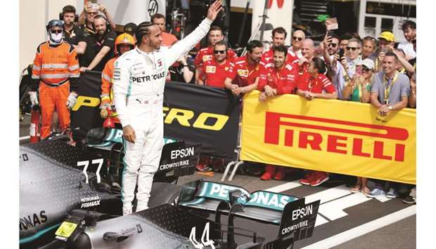 Mercedesu2019 British driver Lewis Hamilton celebrates after winning the French Grand Prix in the parc ferme at Circuit Paul Ricard in Le Castellet, France, yesterday. (Reuters)