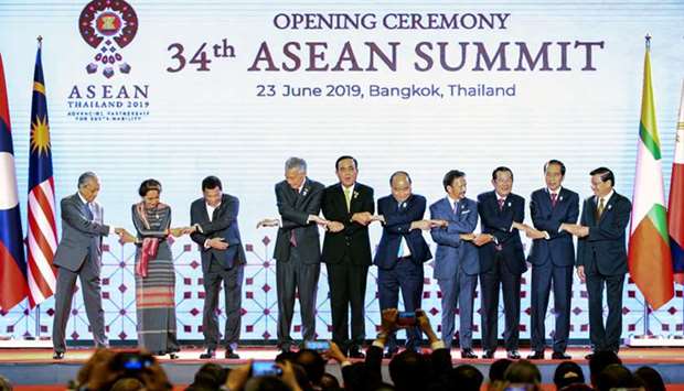 Asean leaders shake hands on stage during the opening ceremony of the 34th Asean Summit at the Athenee Hotel in Bangkok.