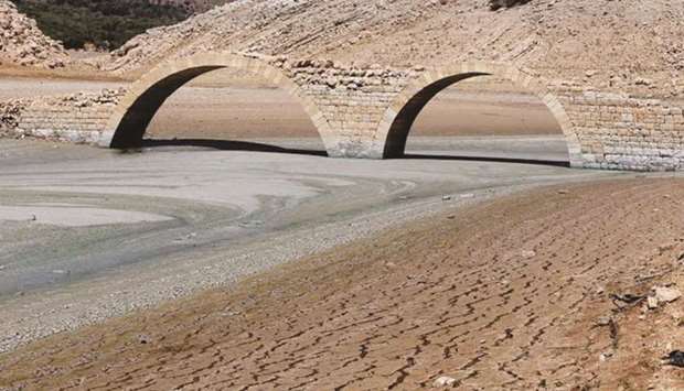 FILE PHOTO: The dried cracked bed of the Qaraoun artificial lake is seen in West Bekaa. In some Arab countries, the water stress level is above 70%, indicating the strong probability of future water scarcity.
