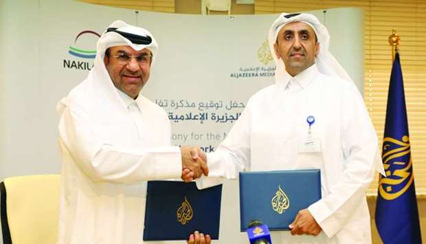 Rashid Hamad al-Marri and Abdullah al-Najjar seal the deal