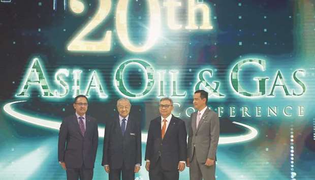 Malaysiau2019s Prime Minister Mahathir Mohamed (2nd from left), Petronas CEO Wan Zulkiflee Wan Ariffin (left), Petronas chairman Ahmad Nizam Salleh (2nd from right) and chairman of the Asia Oil and Gas Conference 2019 organising committee Mohd Yusri Mohamed Yusof pose during the opening ceremony of the 20th Asia Oil & Gas Conference in Kuala Lumpur yesterday.