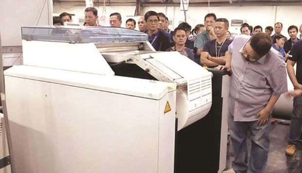 File photo shows Commission on Elections spokesman James Jimenez during the start of the printing of ballots for the midterm elections at the National Printing Office in Quezon City.