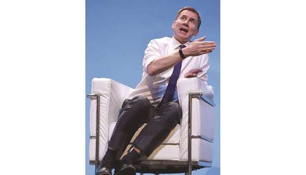 Britainu2019s Foreign Secretary Jeremy Hunt answers questions from journalist Iain Dale and the audience as he takes part in a Conservative Party leadership hustings event in Birmingham, central England, on June 22.