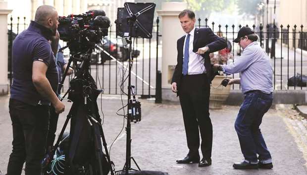 Conservative Party leadership candidate Jeremy Hunt attends an interview outside his home in London yesterday.
