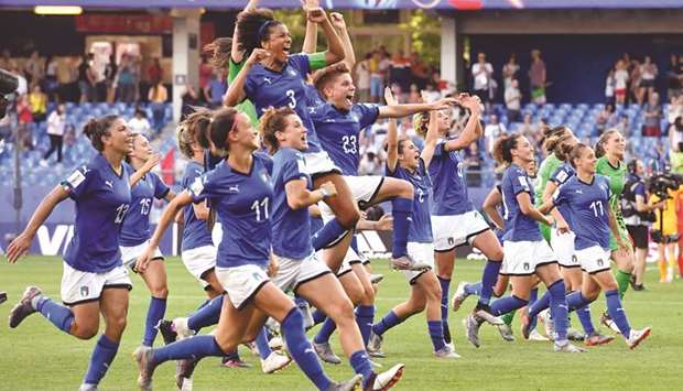 Italy players celebrate after winning their Womenu2019s World Cup last 16 match against China at La Mosson stadium in Montpellier, south western France, yesterday.b(AFP)