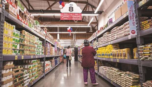 Shoppers browse items inside a grocery outlet in San Francisco. The Federal Reserve Conference Board said its consumer confidence index dropped 9.8 points to a reading of 121.5 this month, the lowest since September 2017, from a downwardly revised 131.3 in May.
