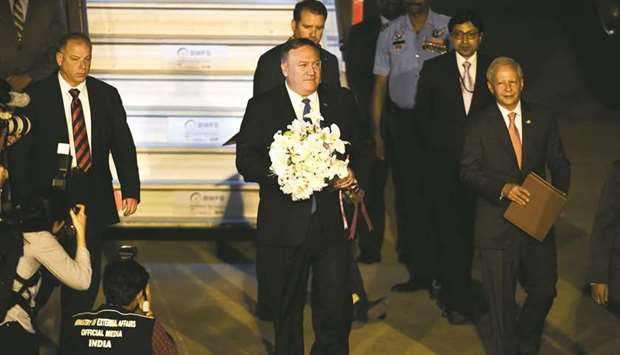 US Secretary of State Mike Pompeo is welcomed with a flower bouquet upon his arrival at the Palam technical airport in New Delhi yesterday.