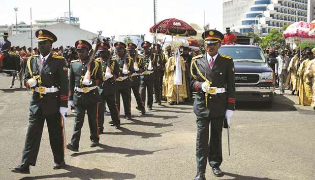 Members of the army and religious leader take part in the funeral parade in Addis Ababa yesterday.