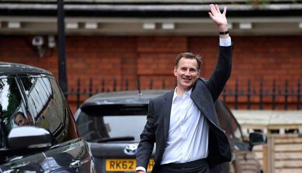 Conservative Party leadership candidate Jeremy Hunt waves as he leaves his home in London, Britain