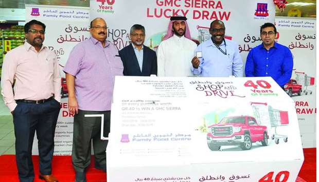 Family Food Centre (FFC), culminating its 40th anniversary celebrations, has announced the winners of the u2019Shop and Driveu2019 car promotion which ran from January 19 until June 19. The Al Kheesa, Al Rayyan, Airport Road and Al Nasr outlets of FFC had one GMC Sierra each for the winners. The winners of the promotion are as follows: Al Nasr - Fatima Musa Madani (coupon No AN 1786496); Al Kheesa - Mohamed Hassan Shaikh (coupon No AK 1169681); Al Rayyan - Mohamed Abdelmotlb Deeb Daloul (coupon No AR 1317760); and Airport Road - Rasel Ahammad (coupon No AP 1780353). ,Family Food Centre congratulates the winners and celebrates this win with each of its customers,, it said in a press statement. FFC's key management staff members were present at the announcement of the final draw winner held at its Al Nasr branch (pictured). PICTURE: Nasar K Moidheen