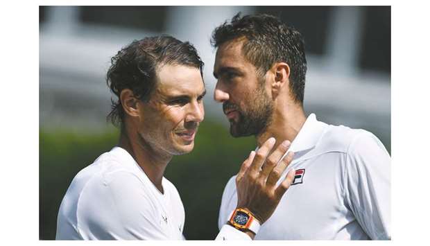 Croatiau2019s Marin Cilic (R) greets Spainu2019s Rafael Nadal after winning their menu2019s singles match at The Aspall Tennis Classic tournament at the Hurlingham Club in London yesterday.