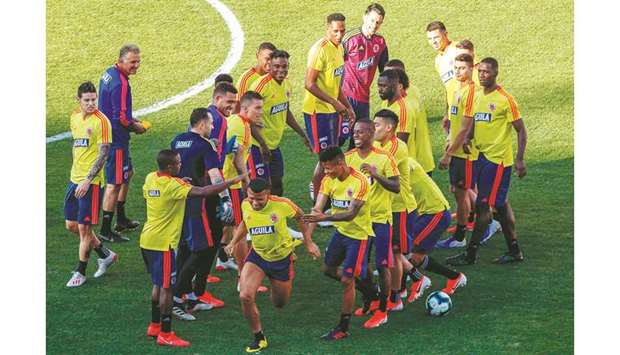Colombia players share a light moment during a training session in Sao Paulo. (AFP)