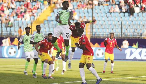 Nigeriau2019s Kenneth Omeruo (centre) scores against Guinea during the Africa Cup of Nations Group B match in, Alexandria, Egypt yesterday. (Reuters)