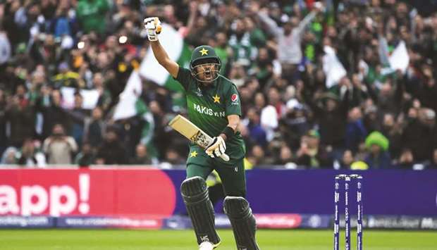 Pakistanu2019s Babar Azam celebrates after scoring a century during the 2019 ICC Cricket World Cup match against New Zealand at Edgbaston in Birmingham, United Kingdom, yesterday. (AFP)