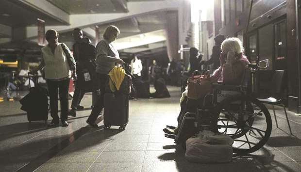 An old woman waiting at Hartfield-Jackson Atlanta International Airport.