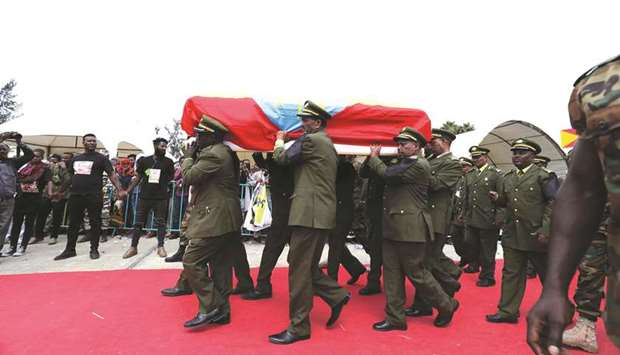 Ethiopian army generals carry the flag-draped coffin of Ethiopian Army Chief of Staff Seare Mekonnen during his funeral ceremony yesterday in Mekele, Tigray Region.