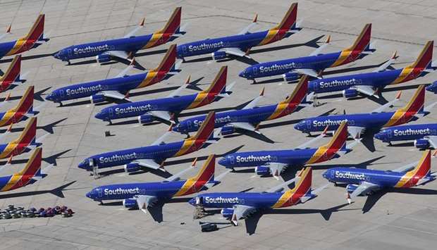n this file photo taken on March 28, 2019, Southwest Airlines Boeing 737 MAX aircraft are parked on the tarmac after being grounded, at the Southern California Logistics Airport in Victorville, California