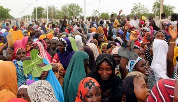Internally displaced people (IDP), mostly women and children sacked by Boko Haram jihadists, block a highway to protest against shortage of food and divertion of aid supplies meant for them by camp officials in Maiduguri, northeast Nigeria