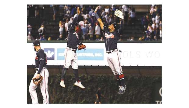 Atlanta Braves centre fielder Ronald Acuna Jr (right) and second baseman Ozzie Albies celebrate after their win over Chicago Cubs at Wrigley Field in Chicago on Wednesday. (USA TODAY Sports)