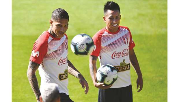 Peruu2019s Paolo Guerrero (left) and Christian Cueva take part in a training session in Sao Paulo, Brazil ahead of their Copa America quarter-final match against Uruguay tomorrow. (AFP)