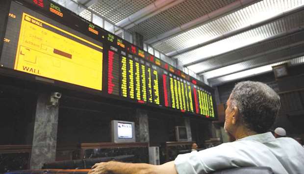 A Pakistani investor monitors the index at the Karachi Stock Exchange (file).