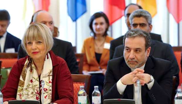 Iran's top nuclear negotiator Abbas Araqchi and Secretary General of the European External Action Service (EEAS) Helga Schmit attend a meeting of the JCPOA Joint Commission in Vienna, Austria