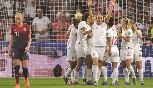 Englandu2019s Lucy Bronze (centre) celebrates after scoring against Norway during the Womenu2019s World Cup quarter-final match in Le Havre, north western France. (AFP)