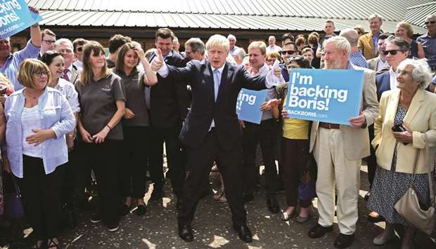 Boris Johnson gives the thumbs up as he leaves an event after addressing party members at The Oaktree Arena in Highbridge, Somerset, Britain, yesterday.