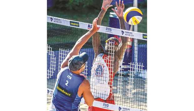 Action from the Qatar-Italy match in Hamburg.