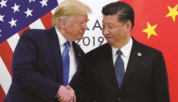 US President Donald Trump meets with Chinau2019s President Xi Jinping at the start of their bilateral meeting at the G20 leaders summit in Osaka, Japan, yesterday.