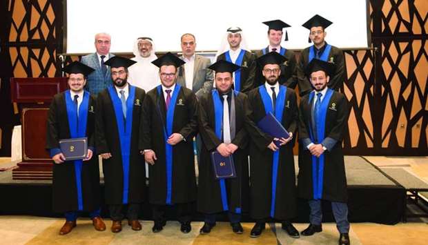 The new doctors with officials.