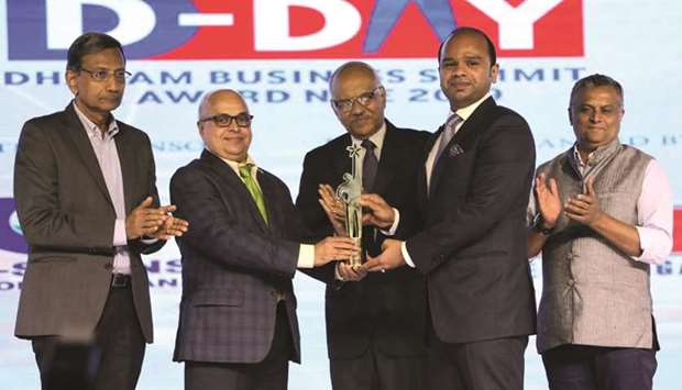 Adeeb Ahamed receiving the u2018NRI Businessman of the Year 2018u2019 award during a ceremony held recently in Kochi, India.