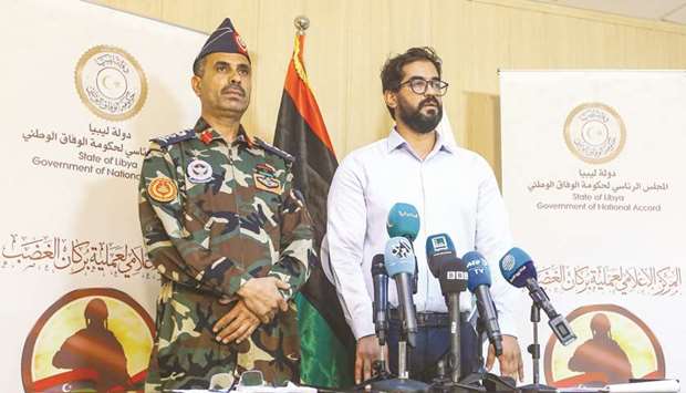 Libyau2019s Government of National Accord (GNA) military spokesman Colonel Mohamed Gnounou (left) and Gharyan Mayor Youssef al-Bdiri give a press conference in Gharyan, 100 kilometres southwest of the capital Tripoli, yesterday, after it was retaken by forces loyal to the GNA.