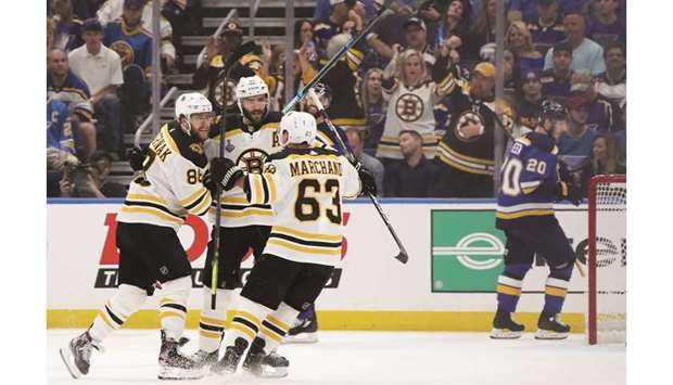Boston Bruinsu2019 Patrice Bergeron celebrates with his teammates David Pastrnak and Brad Marchand after scoring a first period goal against the St. Louis Blues in game three of the 2019 NHL Stanley Cup Final at Enterprise Center in St Louis, Missouri. (Getty Images/AFP)