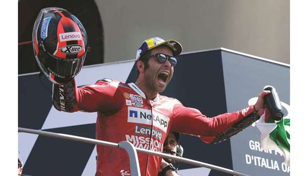 Ducatiu2019s Danilo Petrucci celebrates on the podium after winning the Italian Grand Prix yesterday.
