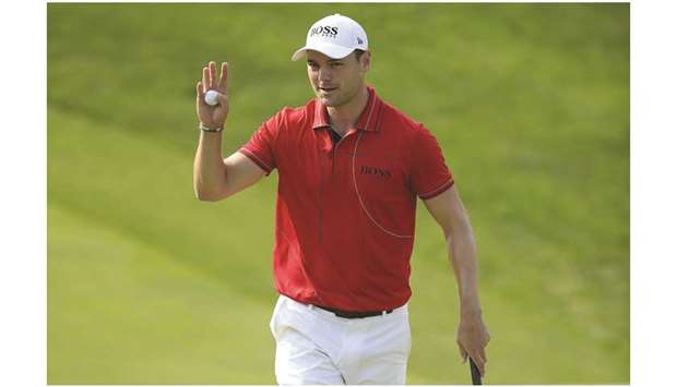 Martin Kaymer of Germany waves to the gallery after making a par on the 18th hole during the third round of The Memorial Tournament in Dublin, Ohio.