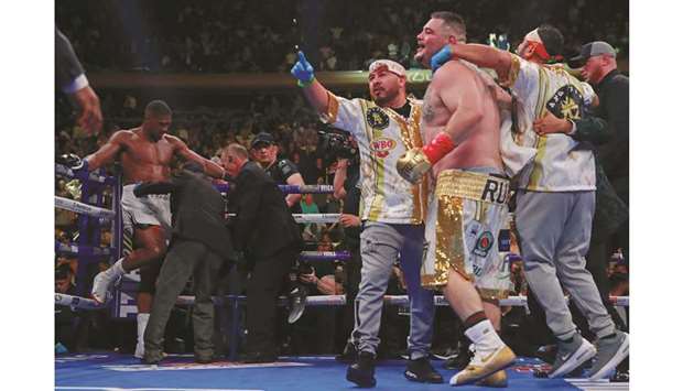 Andy Ruiz Jr (third from right) celebrates with his team after winning the WBA Super, IBF, WBO and IBO world heavyweight titles bout against Anthony Joshua (left) at Madison Square Garden in New York City on Saturday. (Reuters)