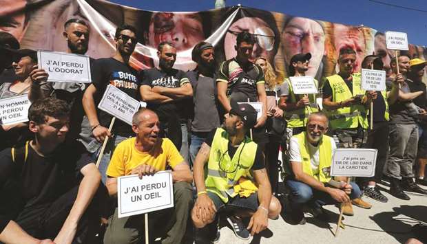 Protesters, some of them claiming to have been seriously injured during the last six months of u2018yellow vestu2019 (Gilets Jaunes) demonstrations, take part yesterday in a march at Place de la Bastille (Bastille Square) in Paris, against police violence.