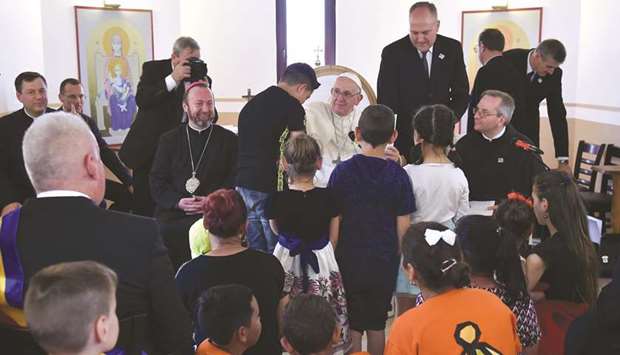 Pope Francis meets members of the Roma community in the Barbu Lautaru district of Blaj, Romania.
