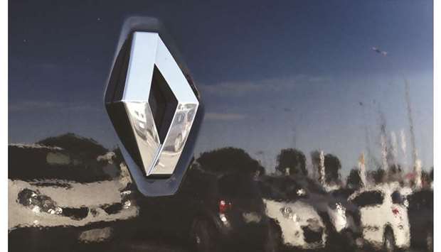 The Renault logo is seen on a car in Paris. France is seeking operational headquarters of the combined company in Paris, and a special dividend for shareholders of Renault, which owns a 43% stake in alliance partner Nissan, as well as a French government seat on the new companyu2019s board after the merger, a ministry spokesman says.